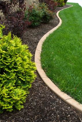 Landscape edging in Moore, OK by Apple Valley Eco Landscapes.